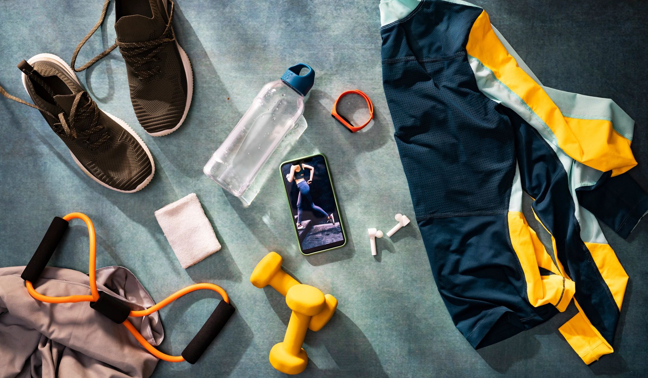 Flat lay of sports gear and mobile device for workout and sports lifestyle