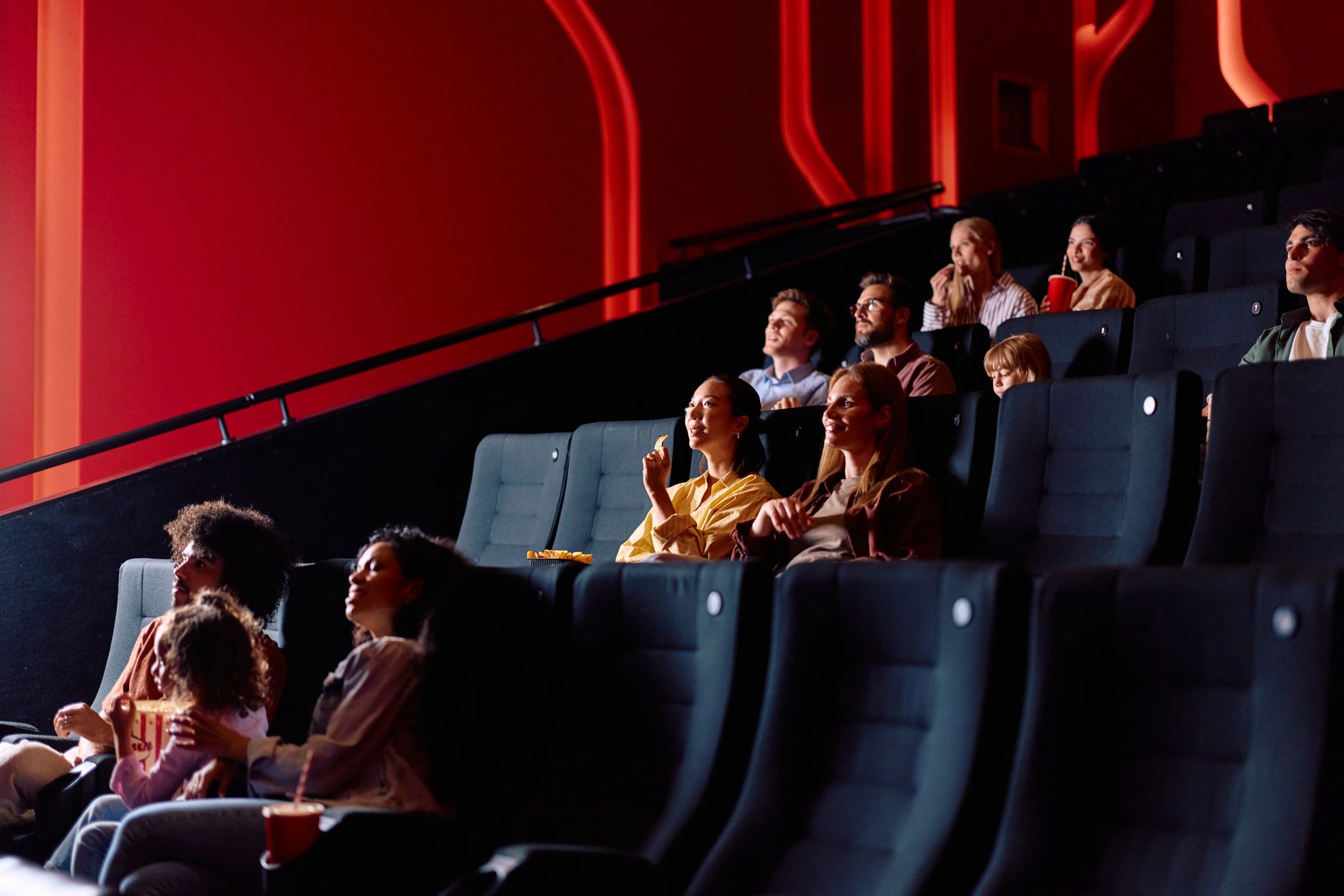 Audience enjoying a live sports-style viewing experience together